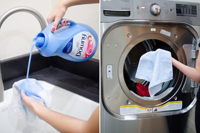 someone pouring downy on towel and putting it in washing machine