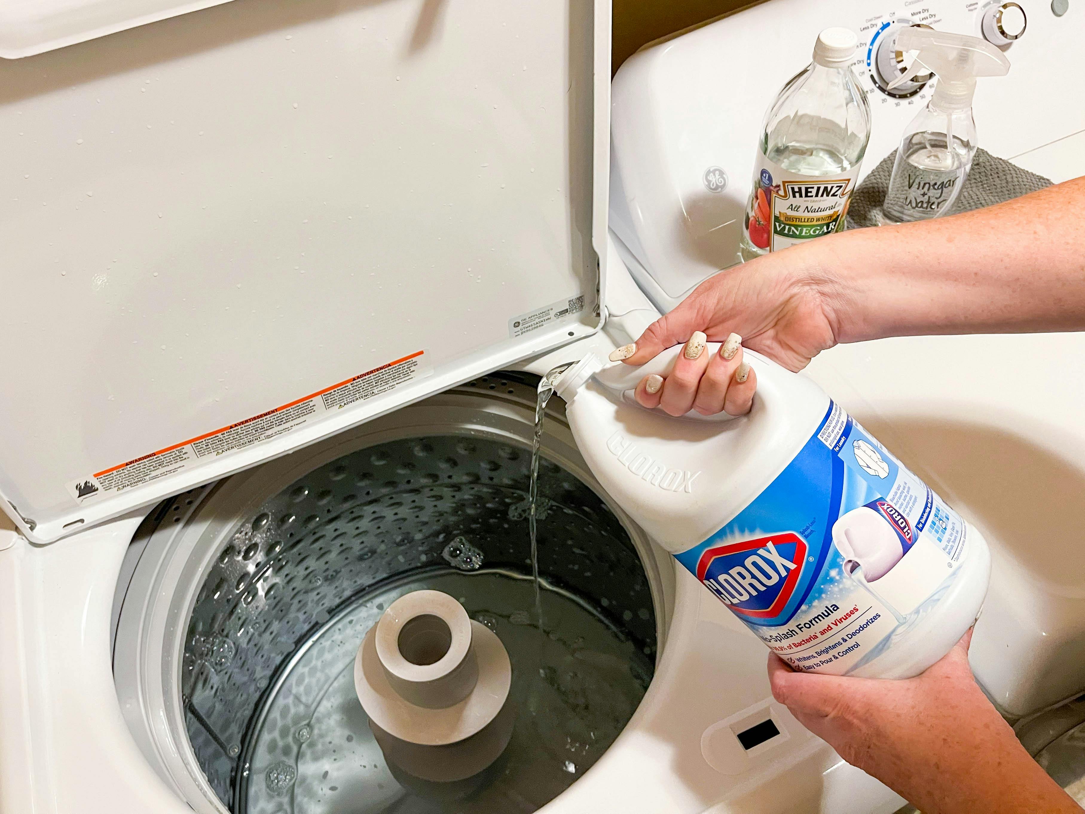 pouring bleach into washer