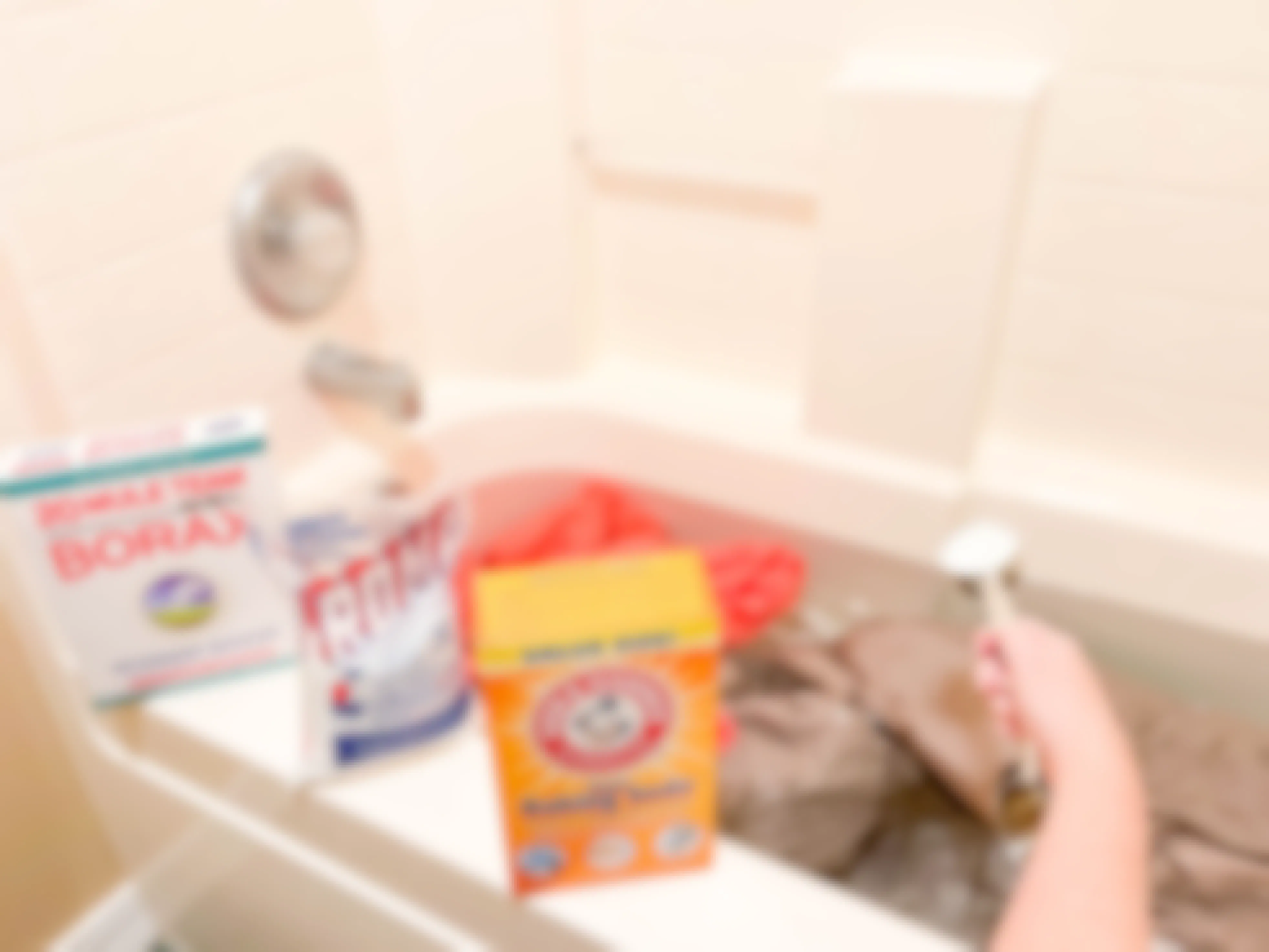 bath tub filled with water and laundry with cleaning products to strip laundry