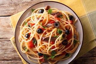 A plate of puttanesca spaghetti