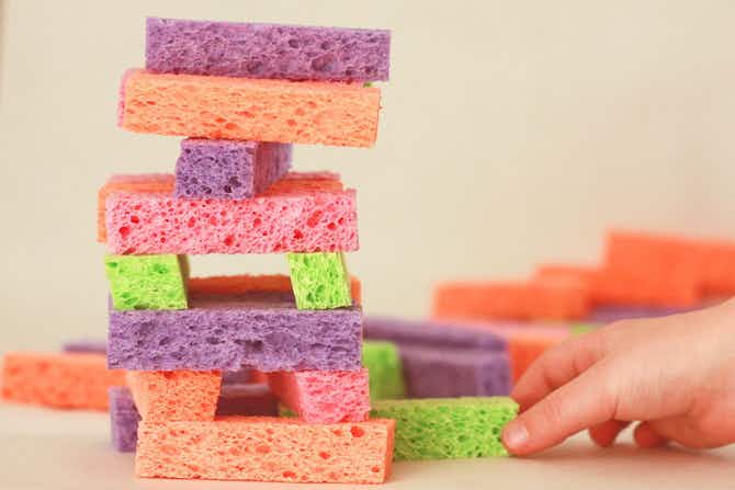 Child stacking sponge blocks.