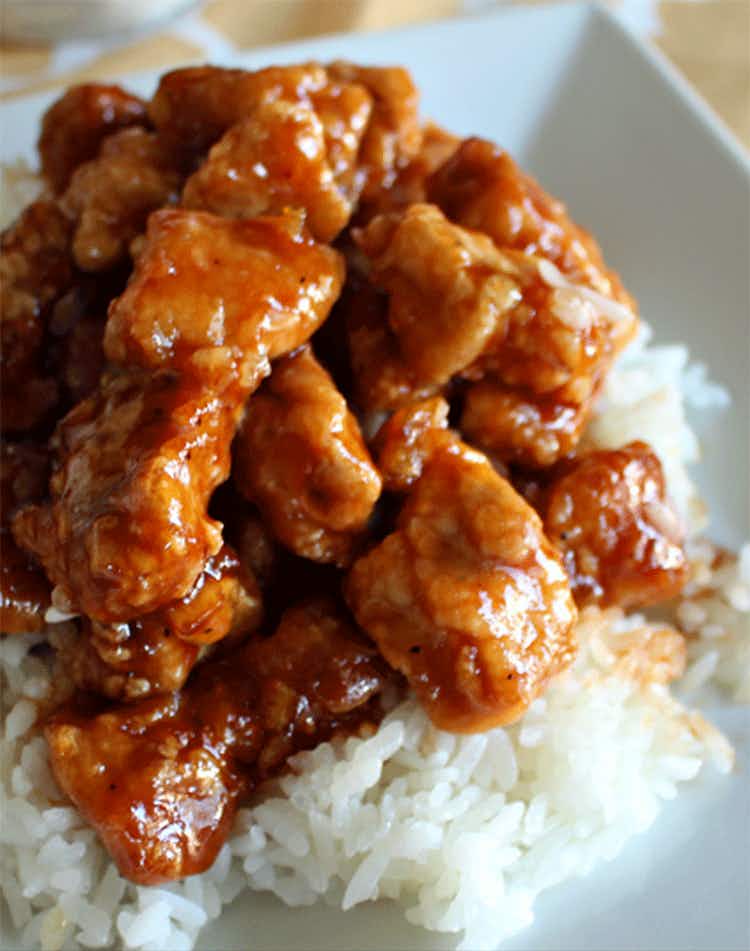 A Panda Express copycat chicken recipe over rice on a plate