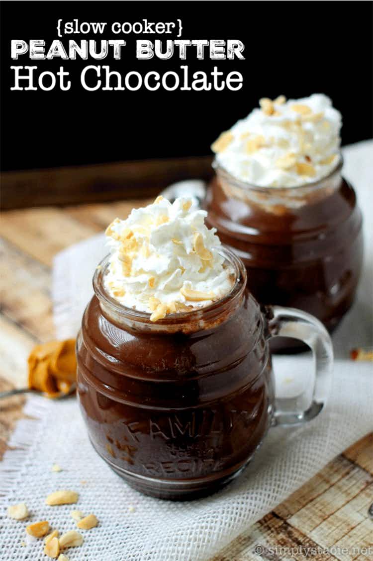glass mugs full of chocolate and topped with whipped cream