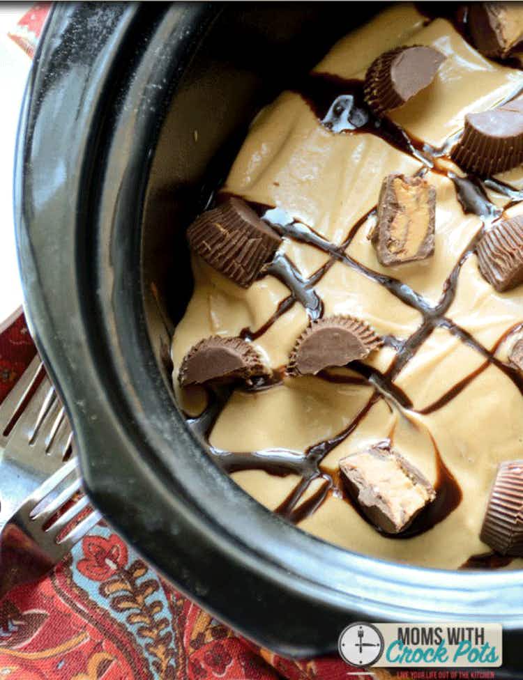 A crockpot with chocolate and peanut butter dessert