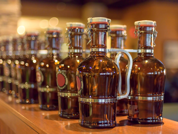 beer growlers sitting on bartop