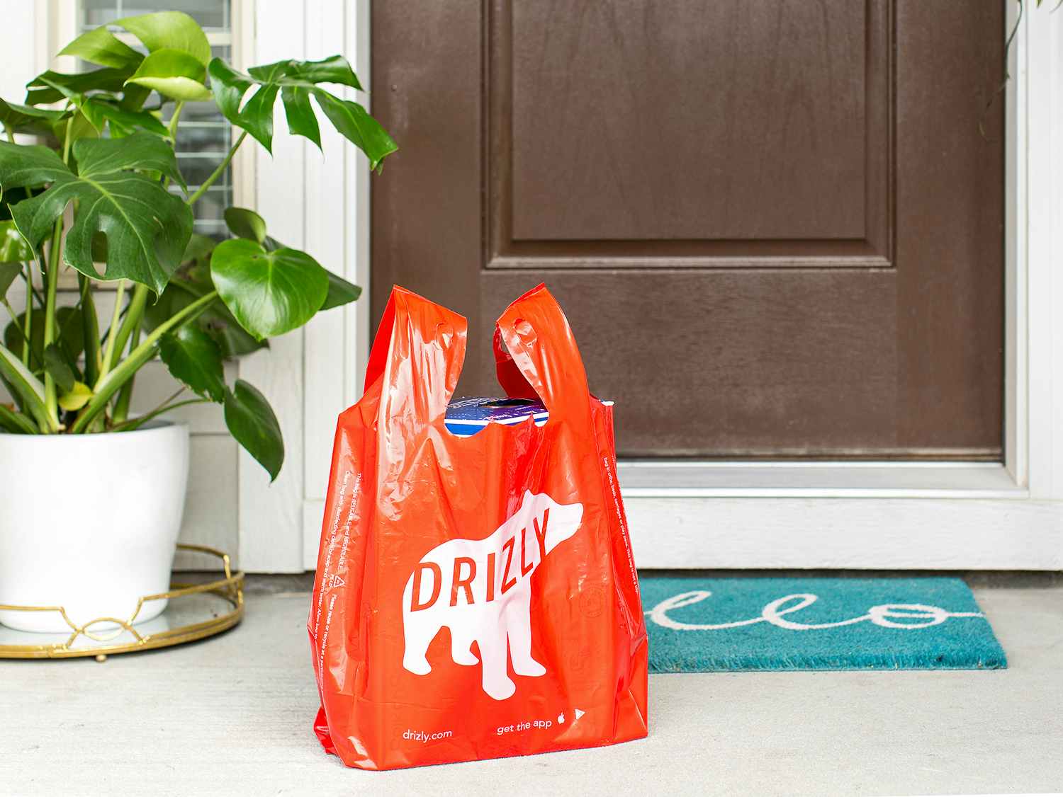 drizly alcohol delivery service bag on front porch