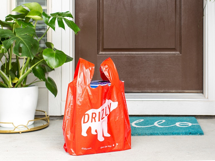 drizly alcohol delivery service bag on front porch