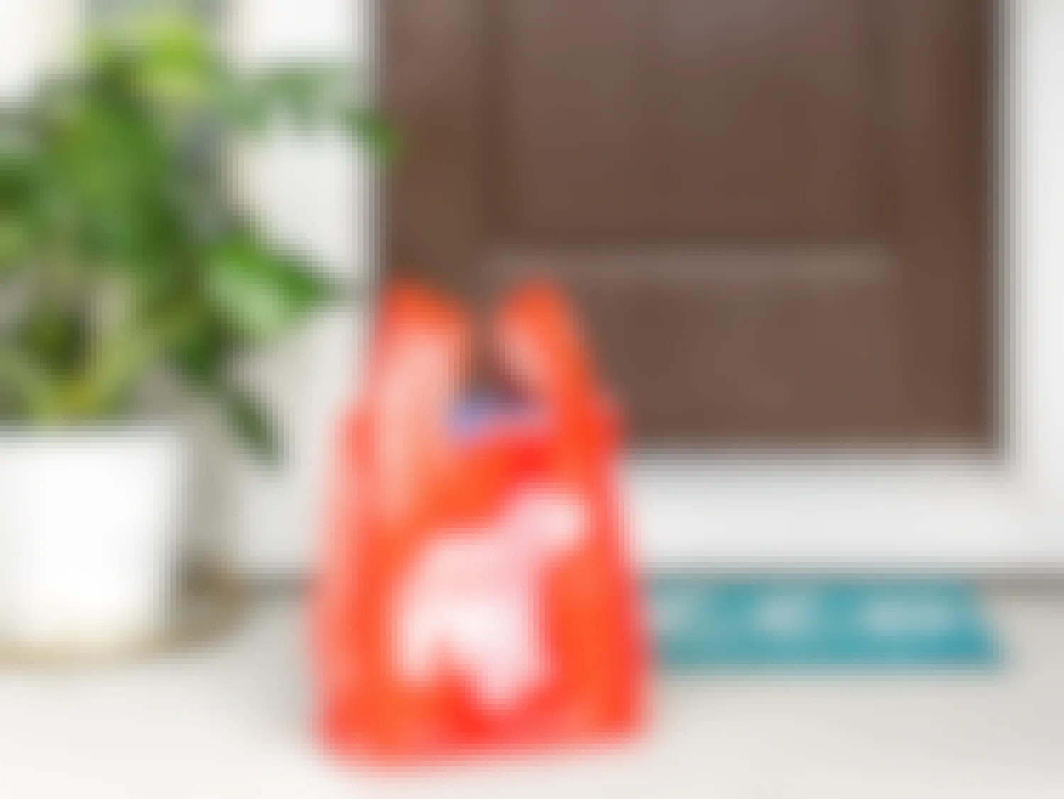 drizly alcohol delivery service bag on front porch