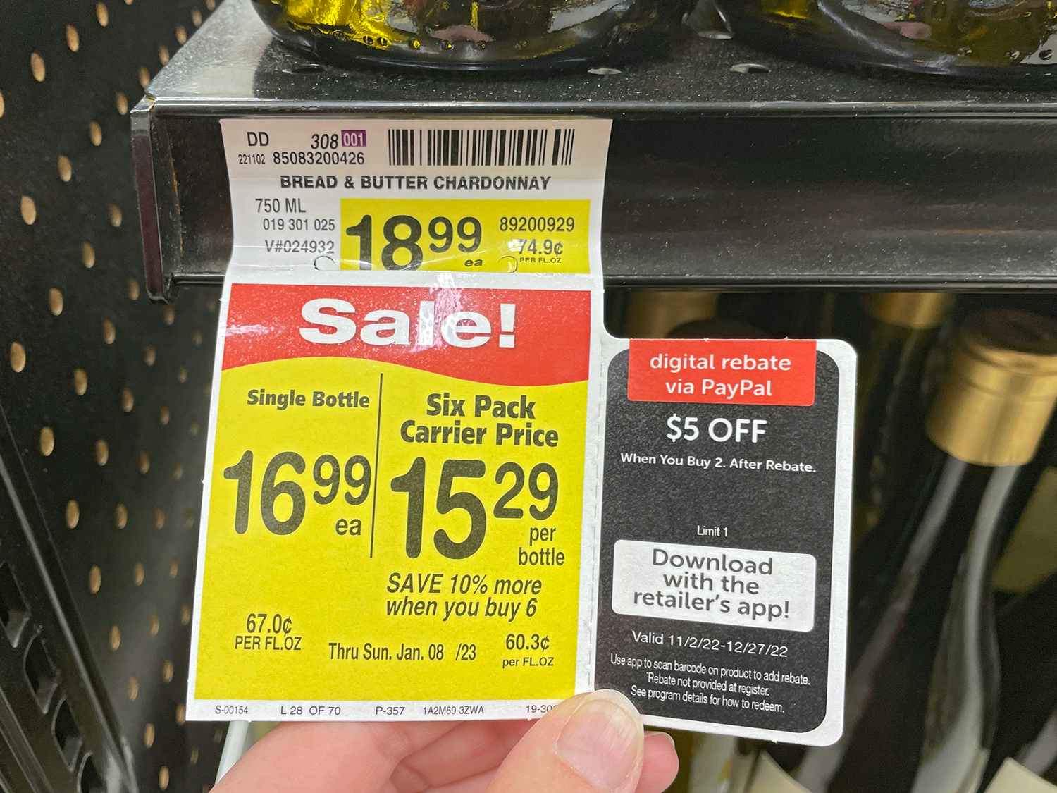 sale tag on chardonnay for bulk six-pack carrier price and rebate signage