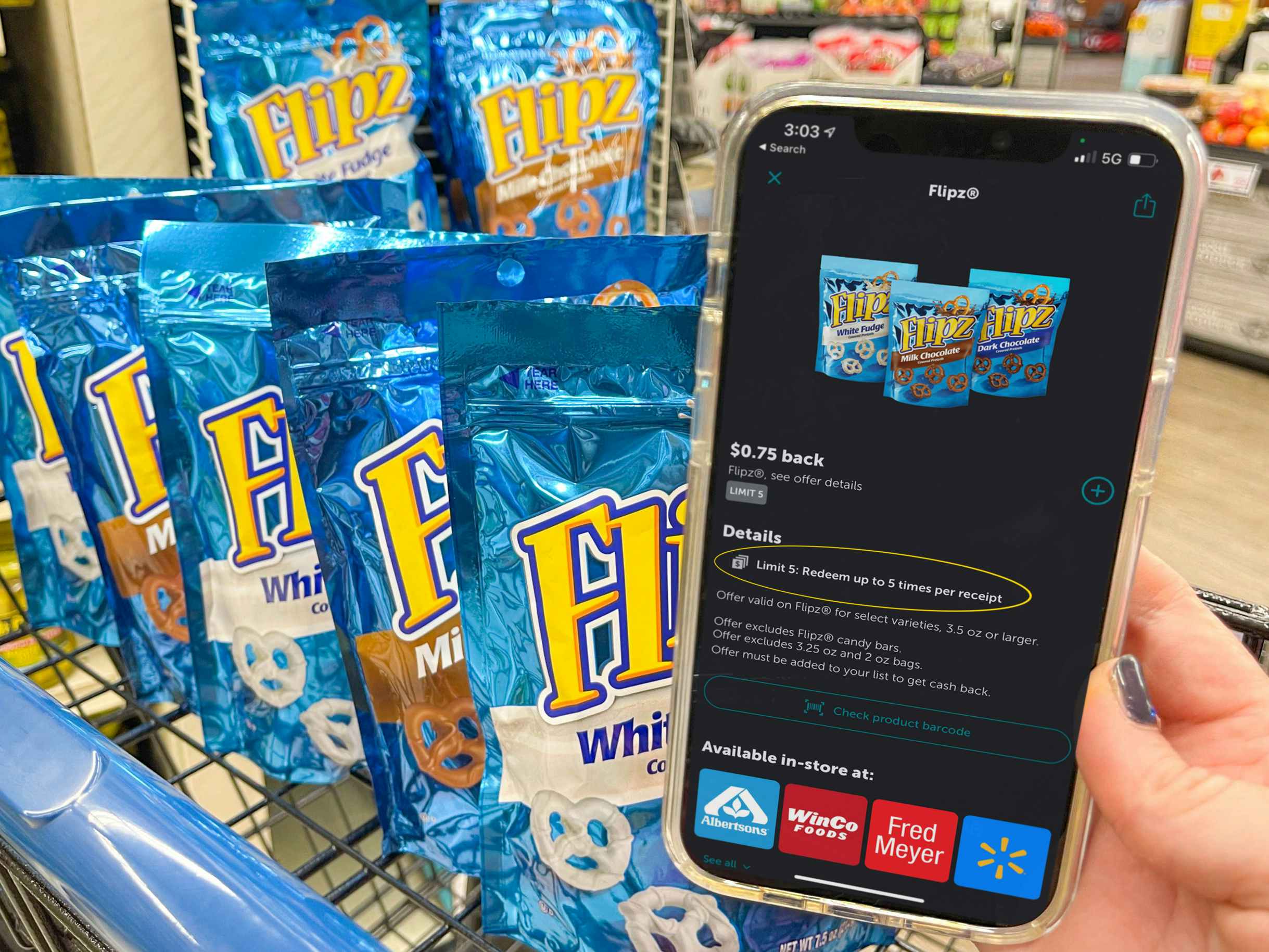 Ibotta app on a cell phone next to a cart filled with flipz