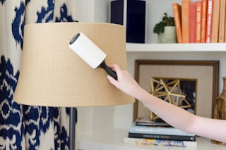 Use a lint remover to dust lampshades and fabric surfaces