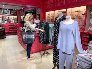 Woman looking at sleep shirts.