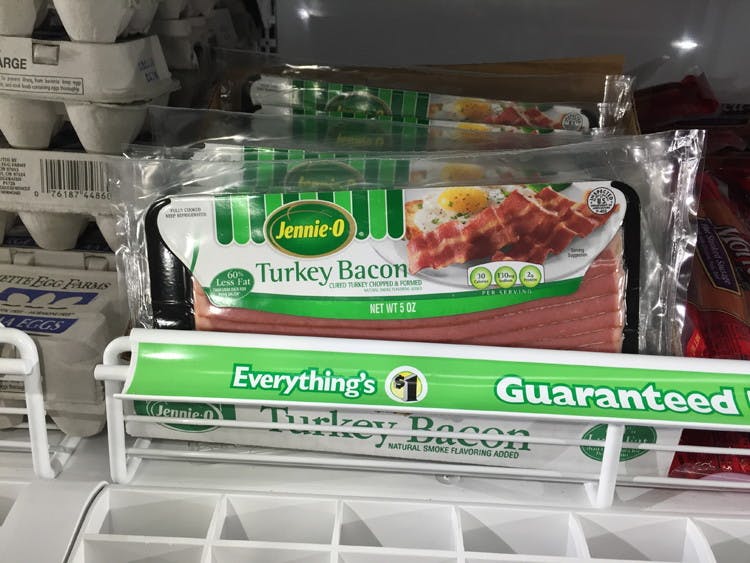 jennie o turkey bacon on grocery store shelf