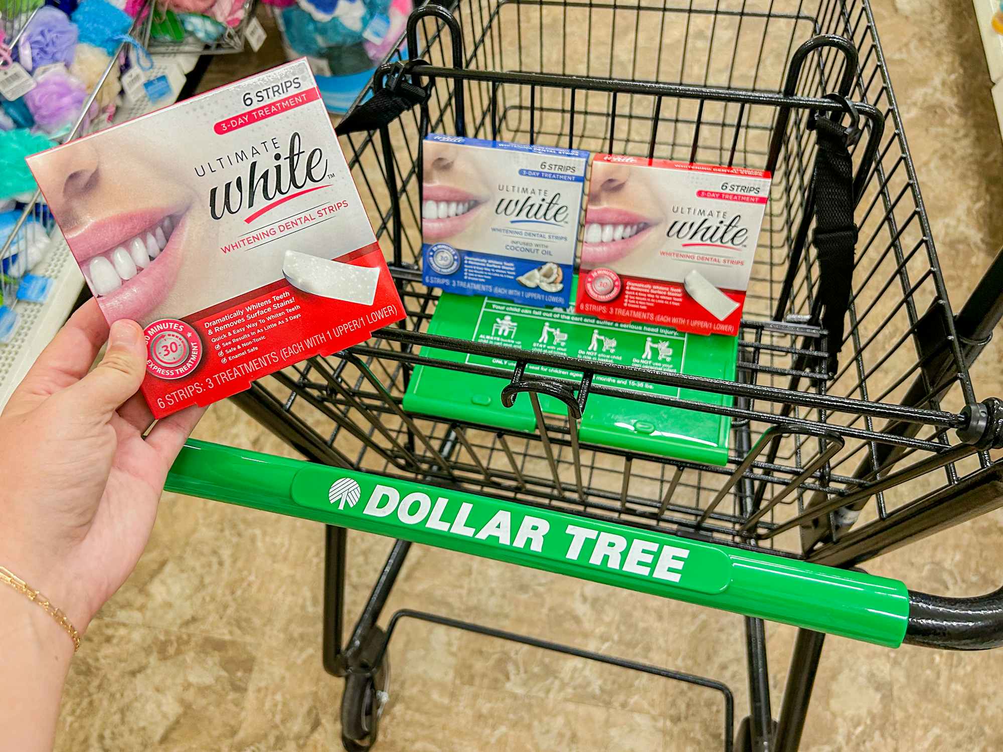a person holding up white strips in a dollar tree