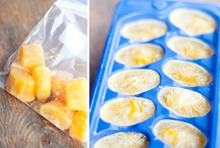 A zip bag and ice cube tray with egg in them.