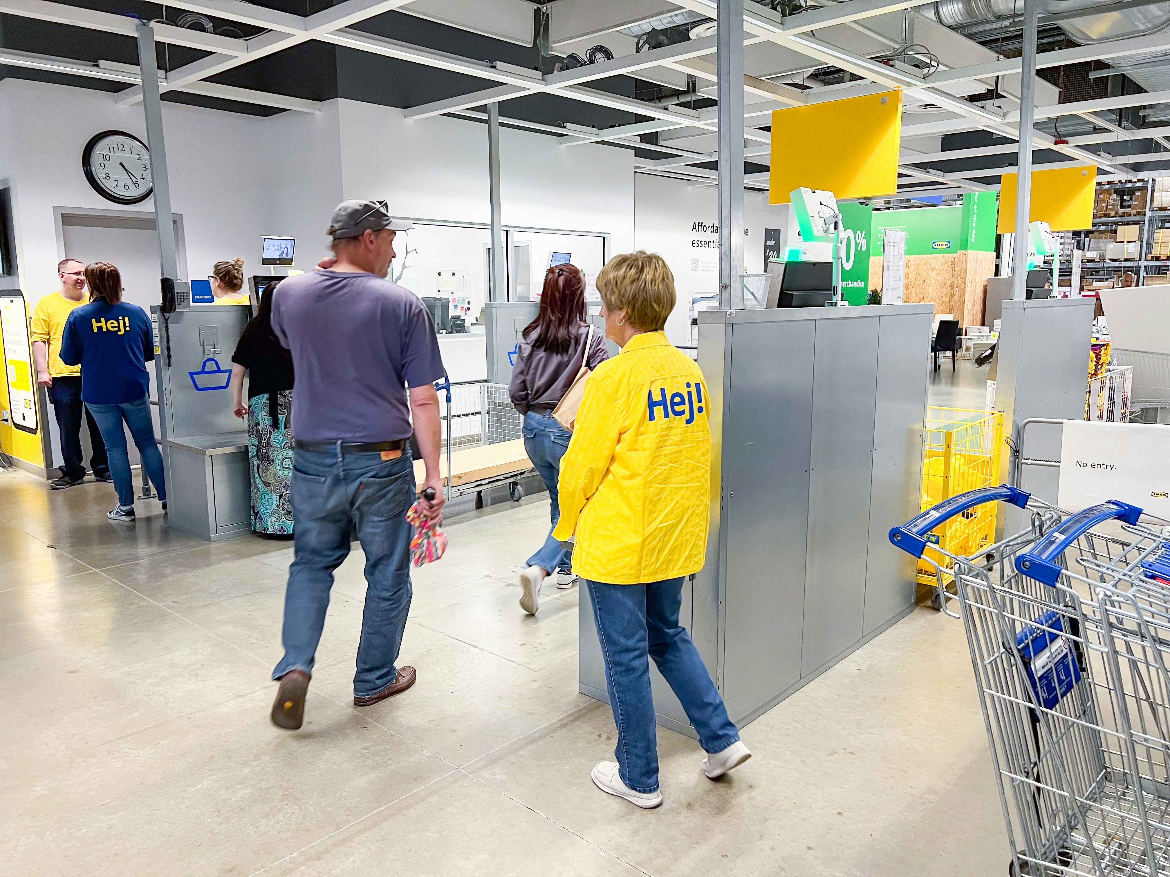 people walking through the checkout at Ikea