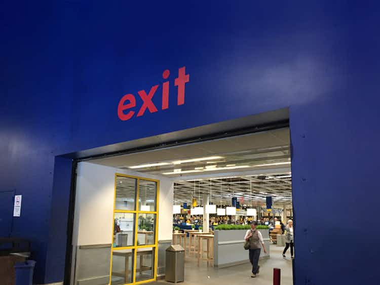 person walking out of an ikea store exit