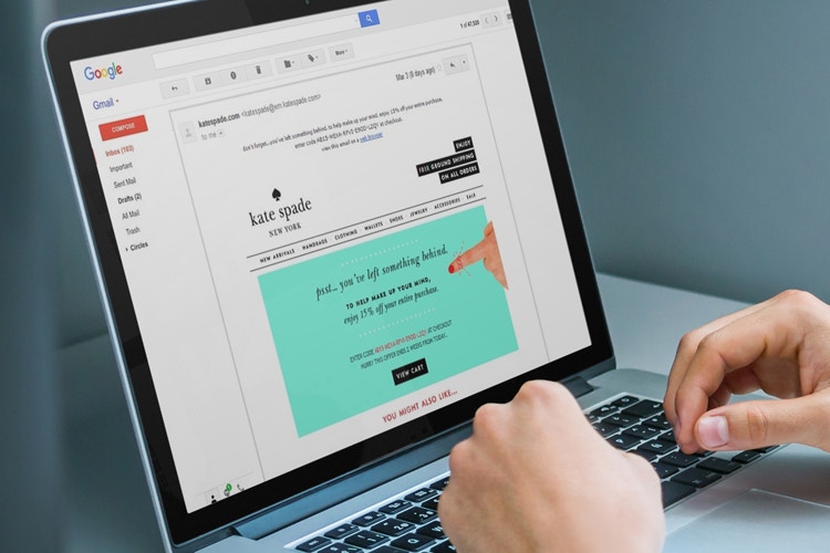 Person looking at a Kate Spade discount code in their email.