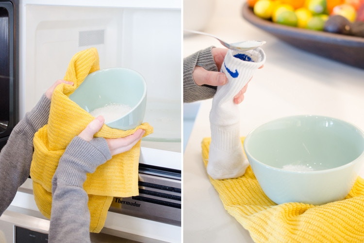 person heating up bowl of salt and pouring into sock