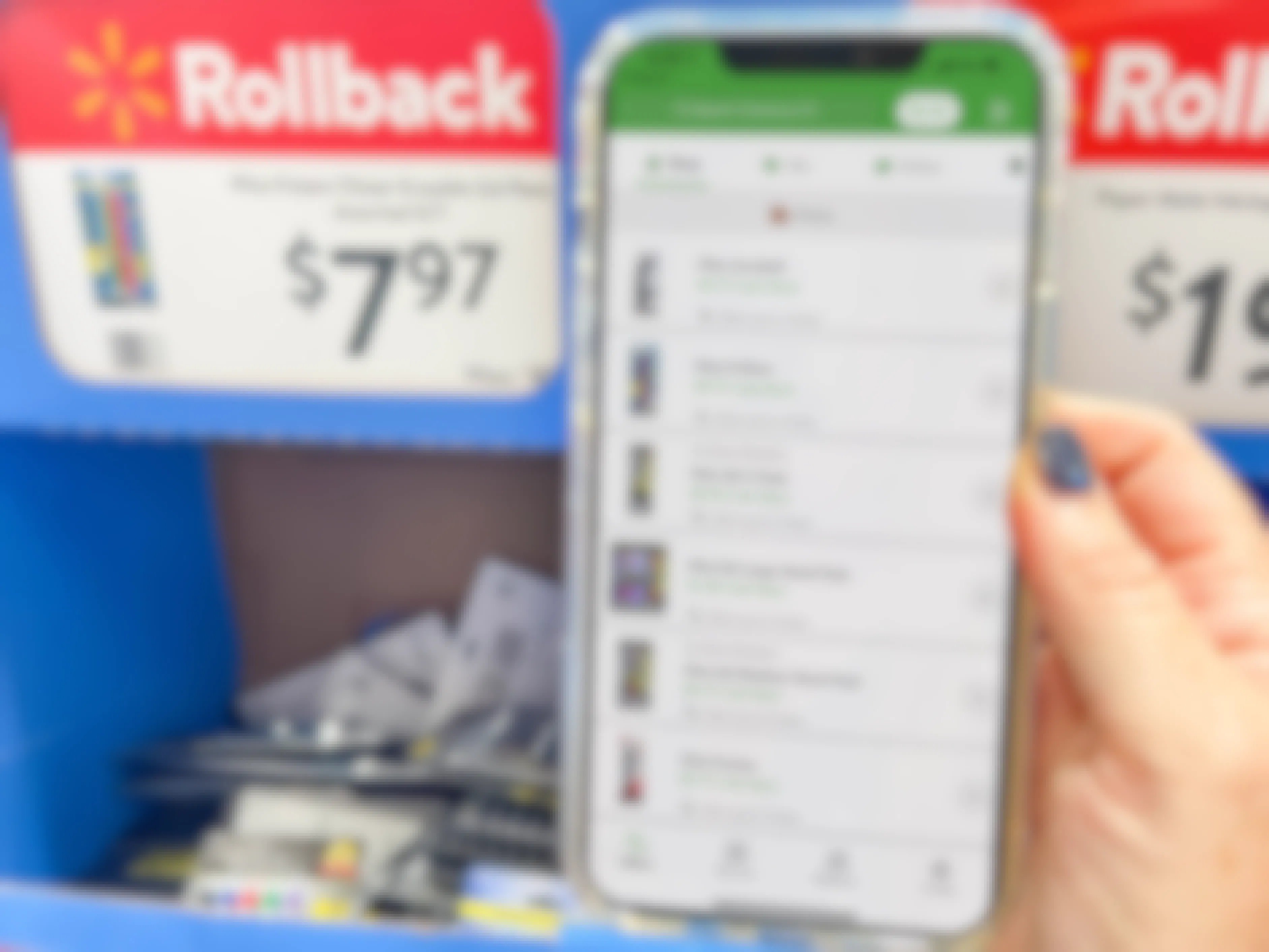 cellphone with checkout 51 app held up in front of rollback sign