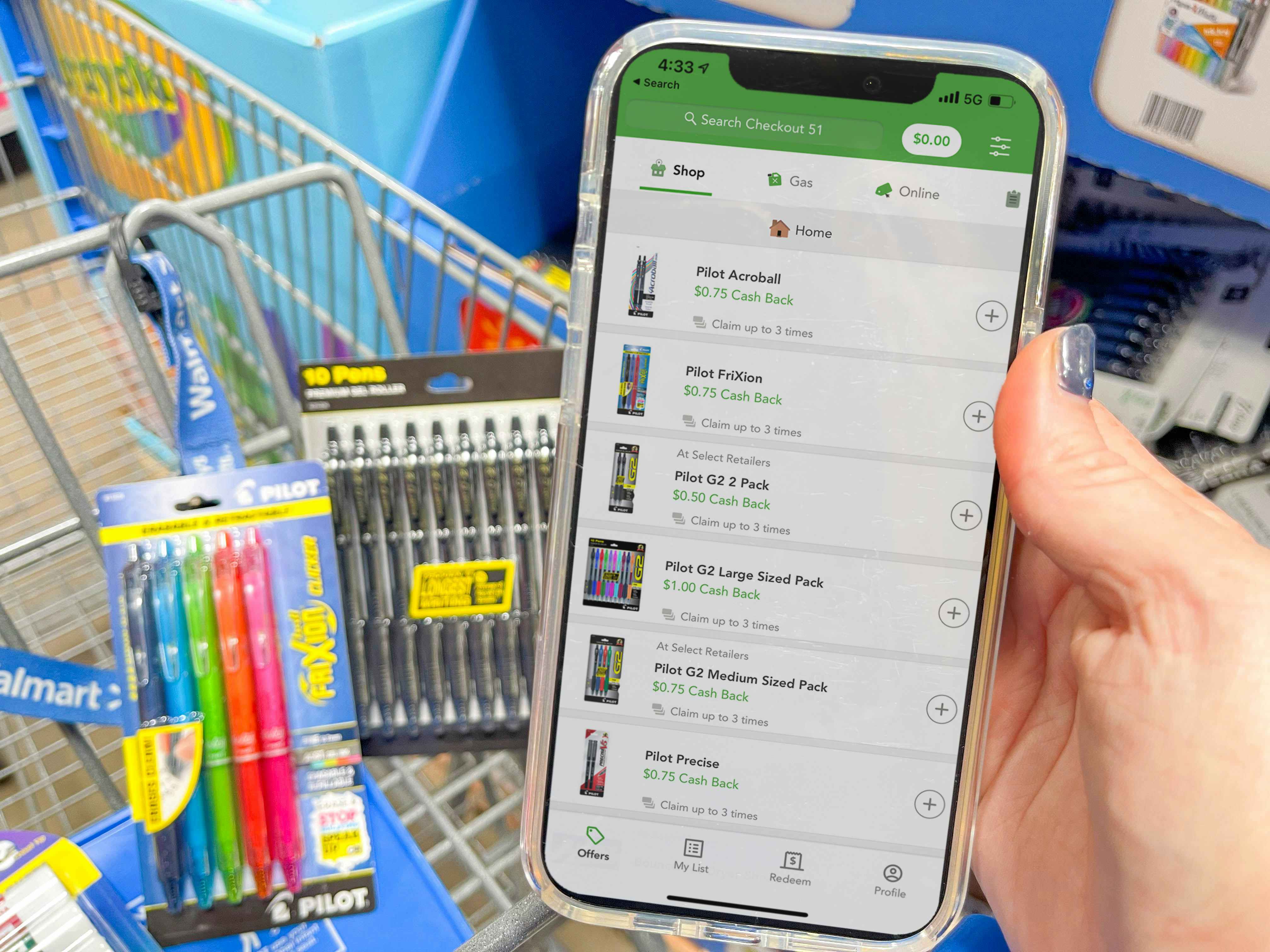 cellphone with checkout 51 app held up in front pens in cart