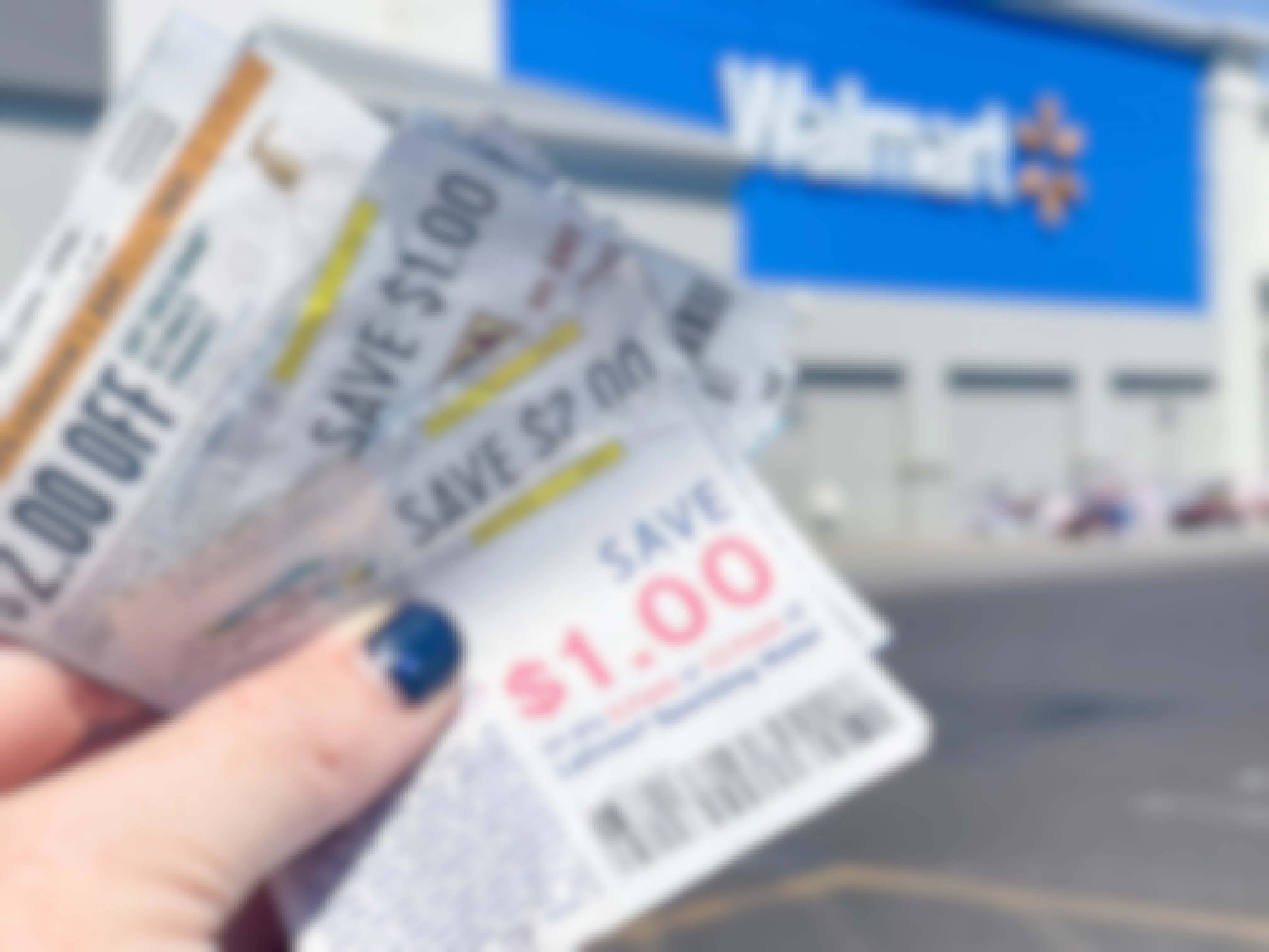 coupons held outside a walmart storefront