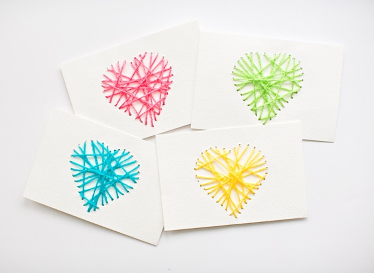 cards made with hearts threaded with yarn