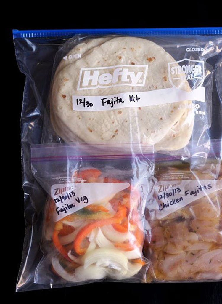 Tortillas, onions, peppers and chicken in a ziploc bag