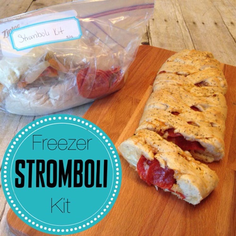 A pepperoni stromboli next to a freezer bag with "Stromboli Kit" label