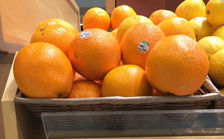 Oranges on display in a store