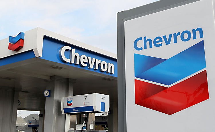 Chevron logo pictured in front a gas pump