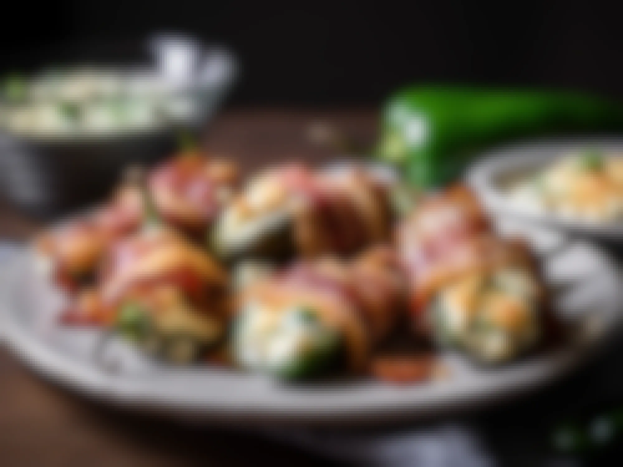 A plate of bacon wrapped stuffed jalapeno poppers