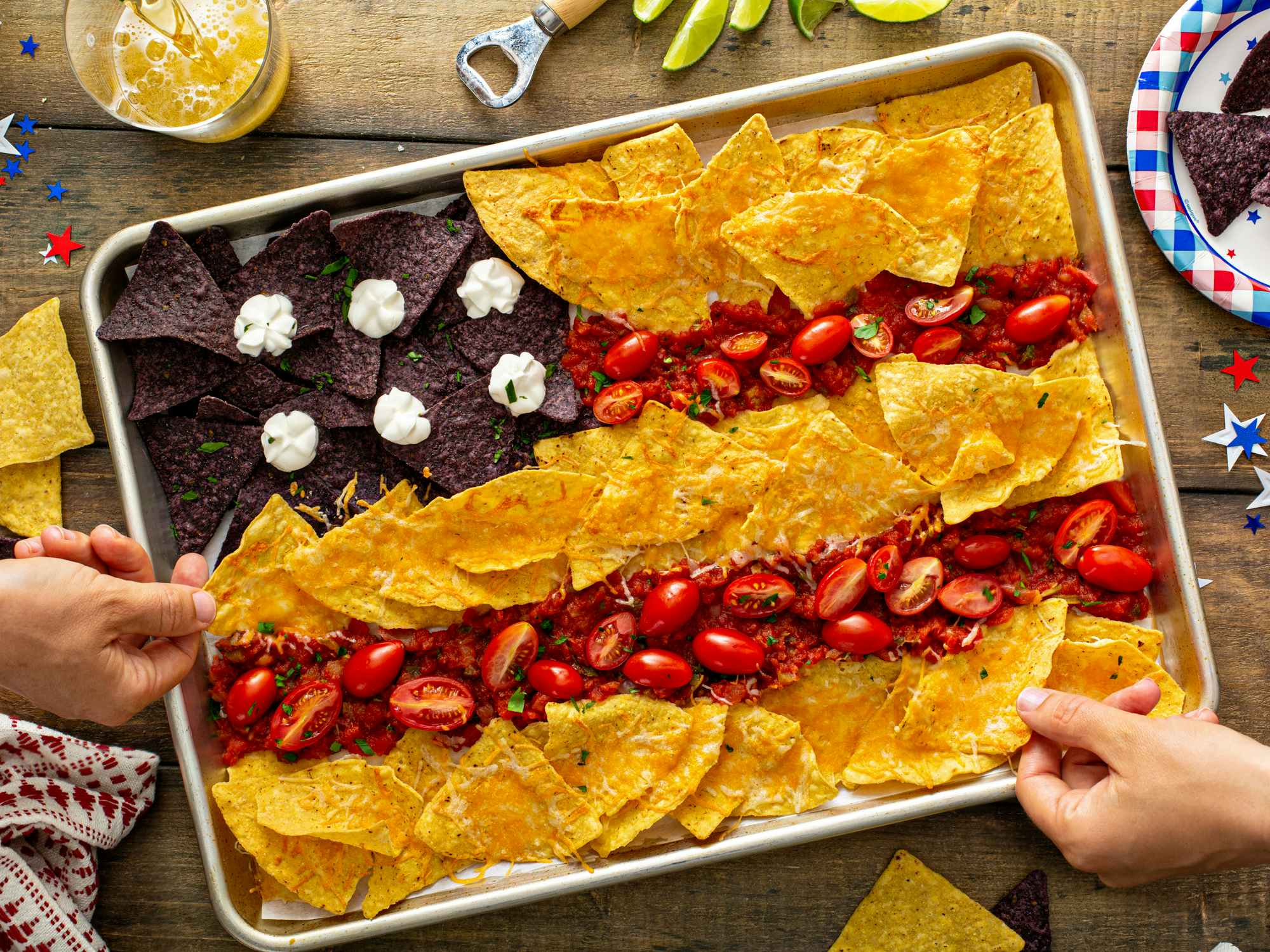 Some nachos in a shape of american flag on a tray for 4th of July 