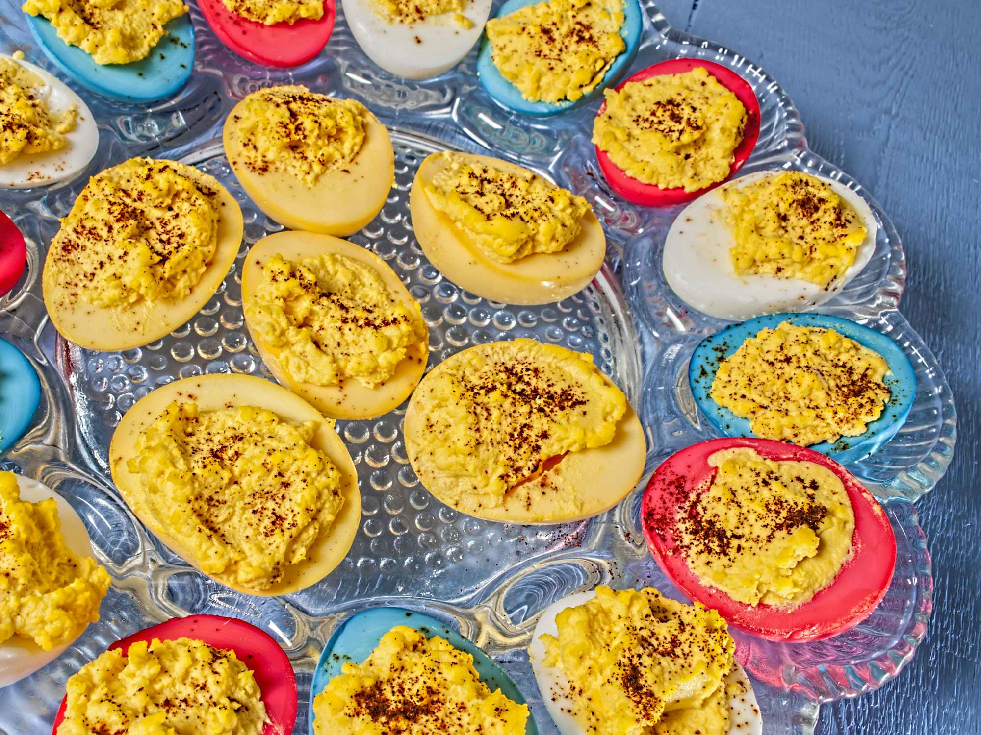 A platter of red white and blue dyed deviled eggs