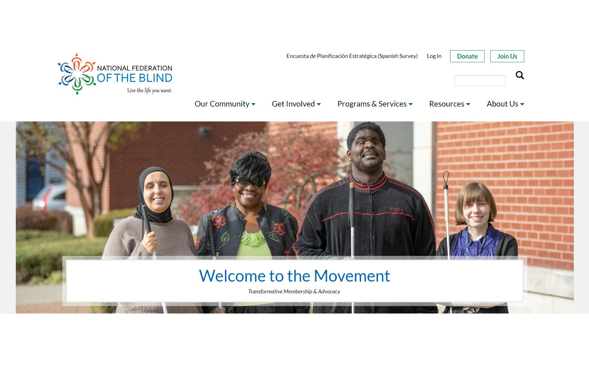 The National Federation of the Blind website with four visually impaired people each holding a cane.