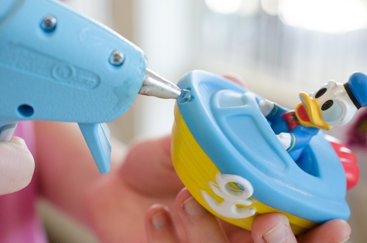 Prevent mold from forming in kids' water toys by plugging the hole with hot glue.