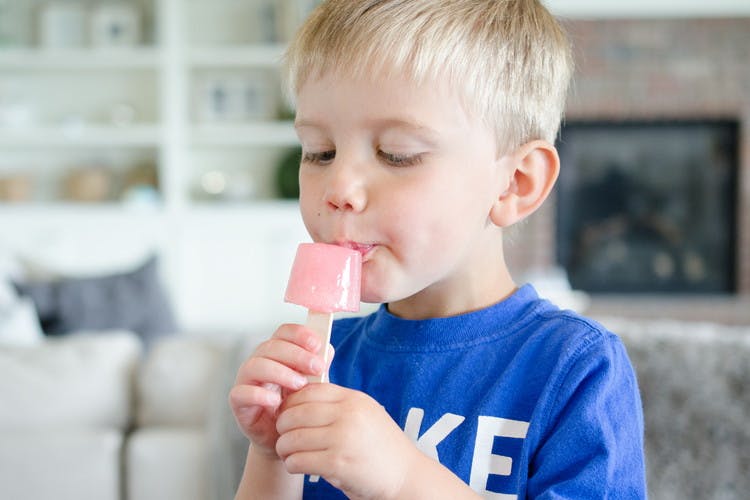 A child eating a popsicle.