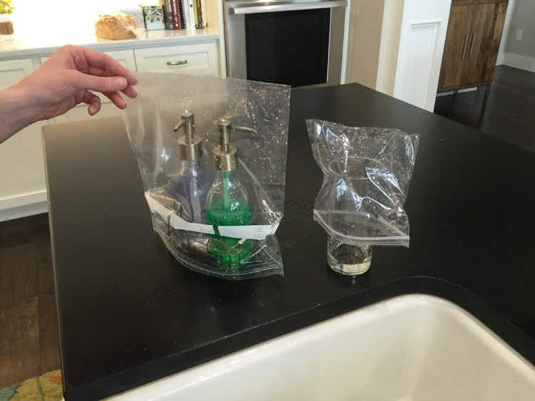 Ziplock bags washed out and drying on soap containers