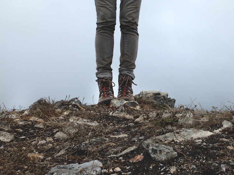 someone standing on rocks