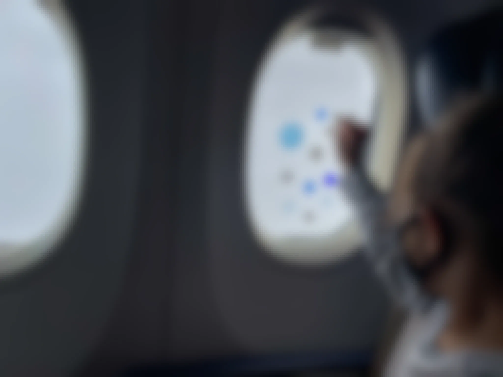 A little girl playing with gel window clings on an airplane