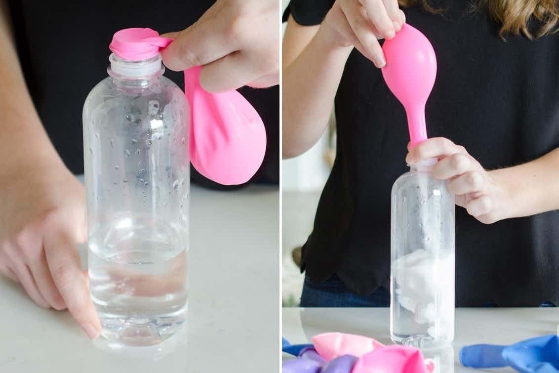 A person holding a balloon on top of a bottle.