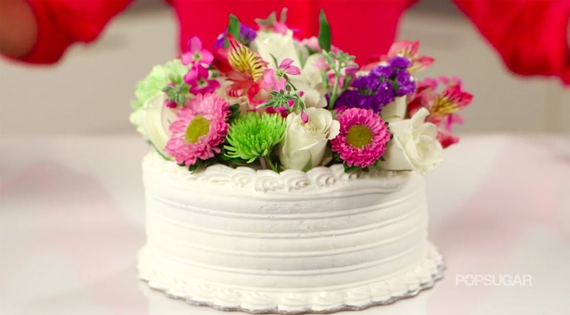 Hack a grocery store cake by adding your own fresh-flower toppers.