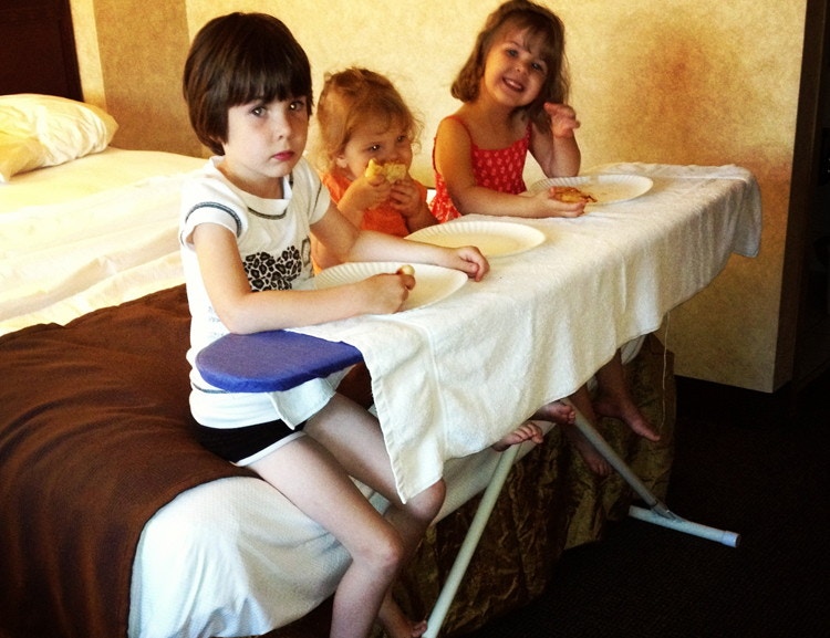 Use the ironing board in your hotel room as an impromptu dining table.
