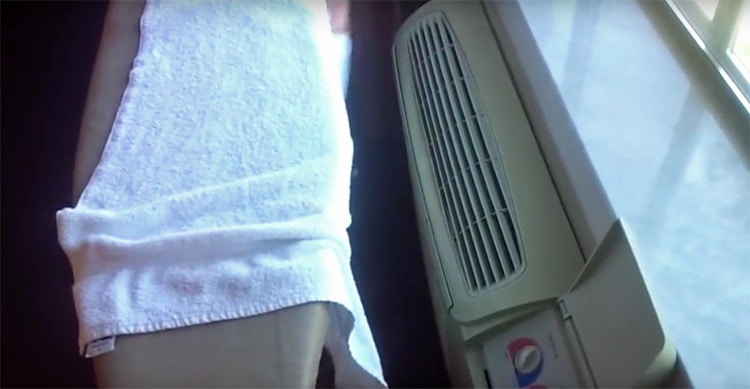 Place a damp towel near the hotel room A/C unit for a makeshift humidifier.