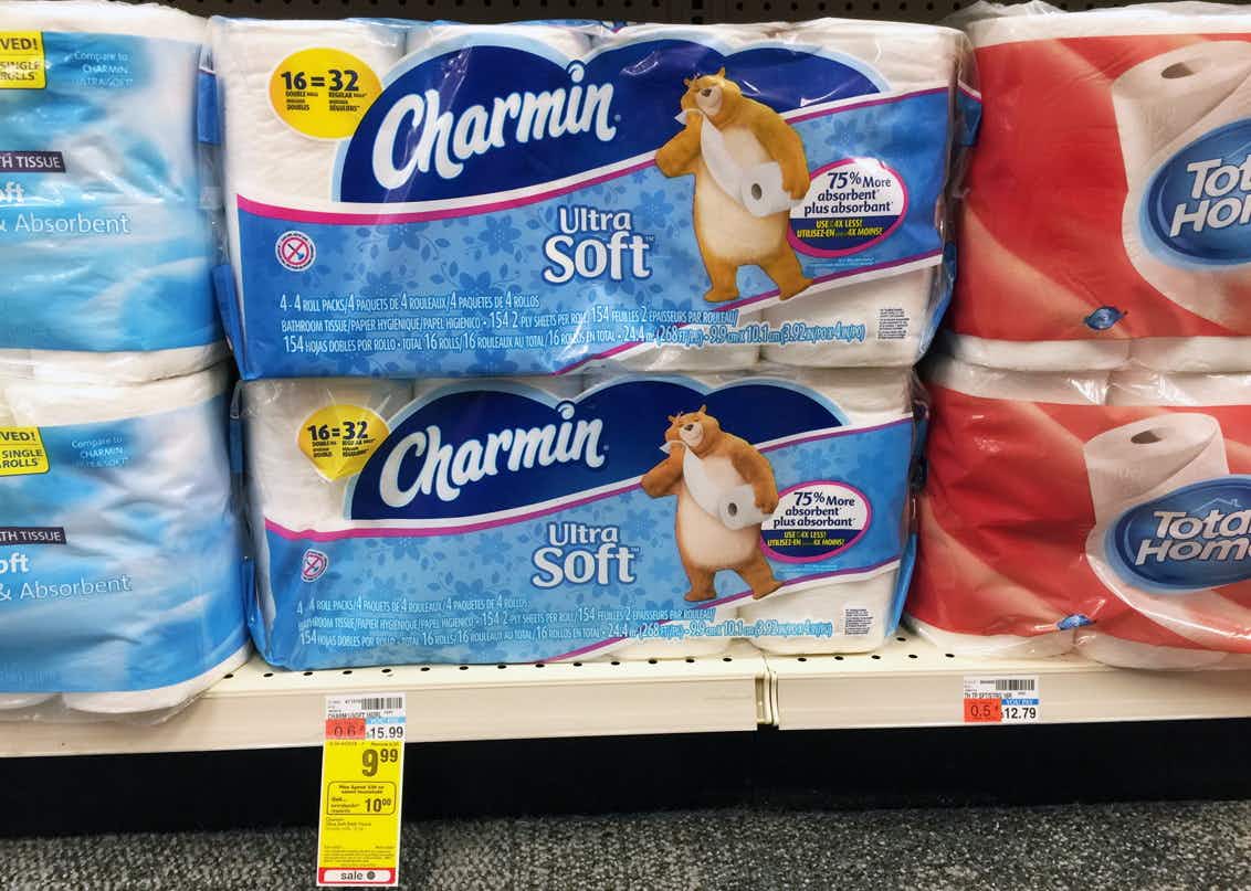 Packages of Charmin toilet paper on store shelf in CVS.