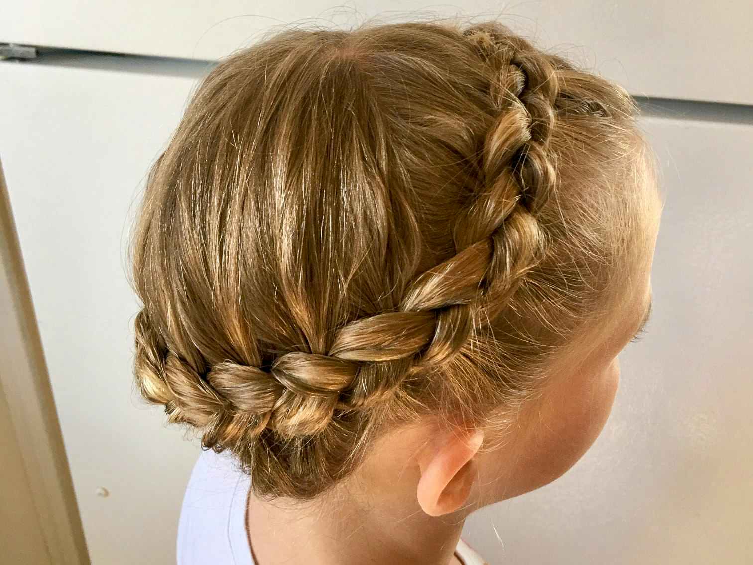 A young girl with a crown braid