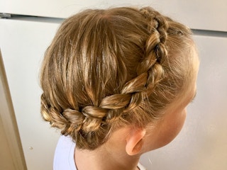 A young girl with a crown braid