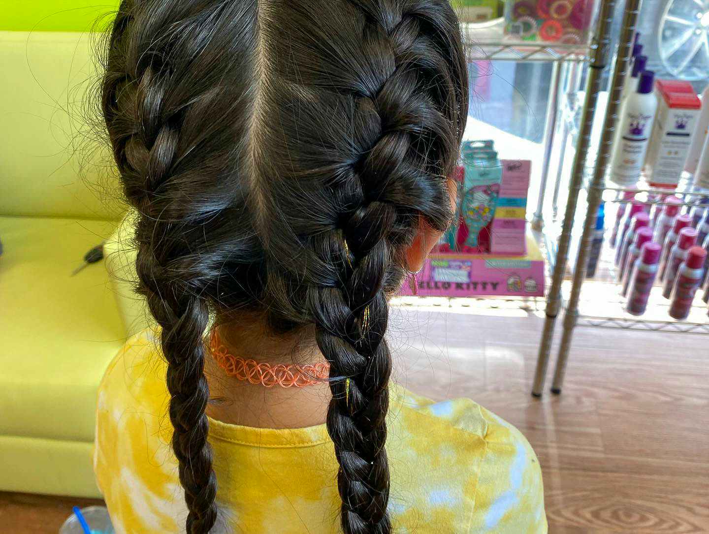 A young girl with two french braids