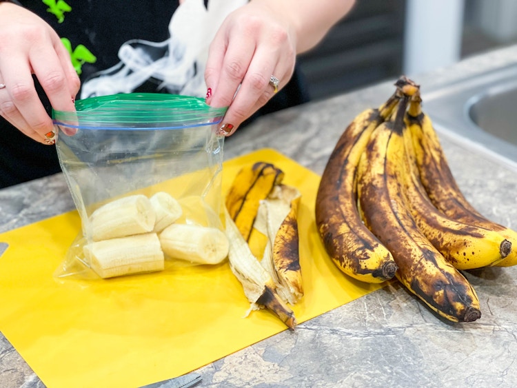 brown banana pieces being put in sandwich bag