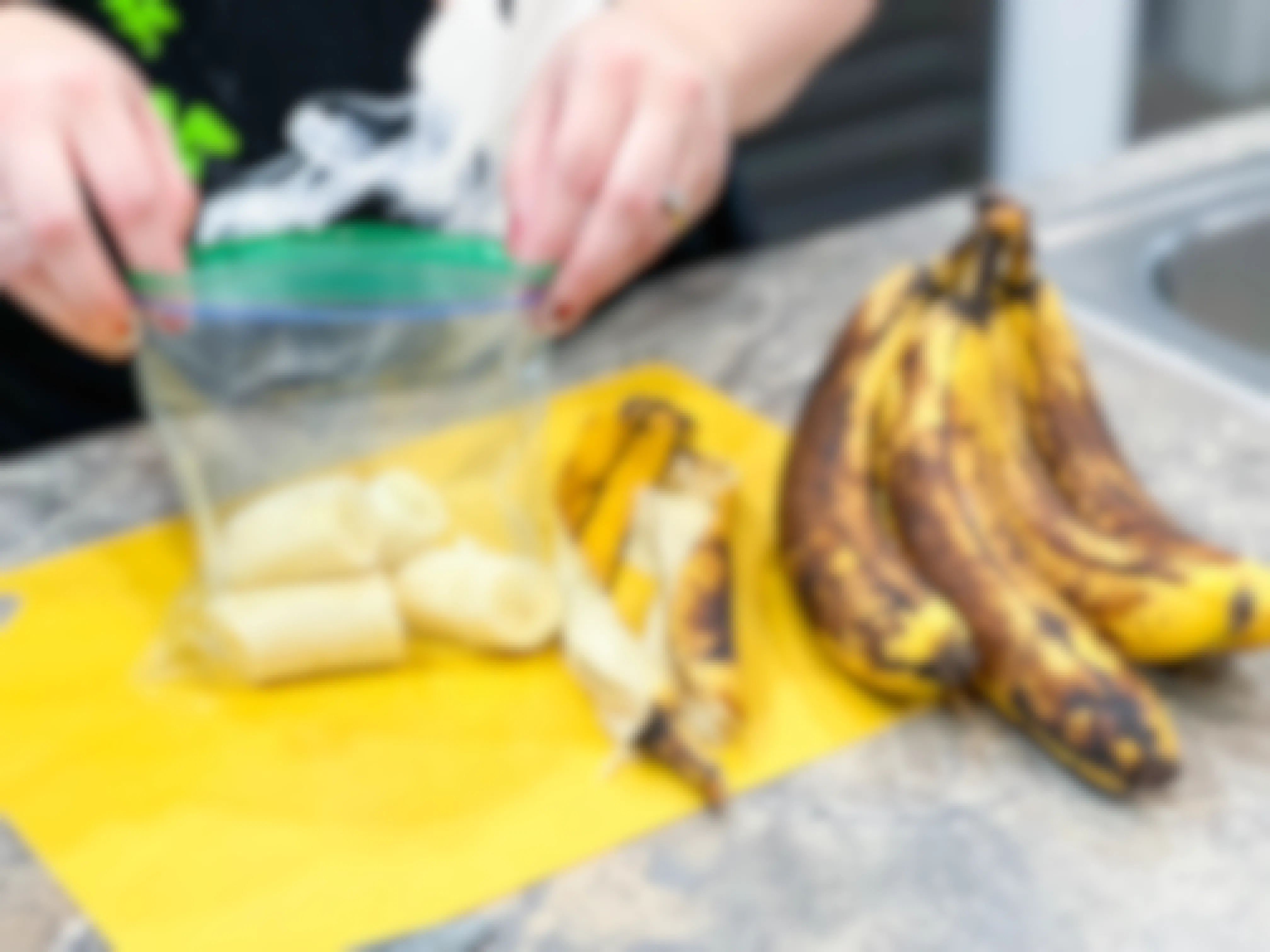 brown banana pieces being put in sandwich bag